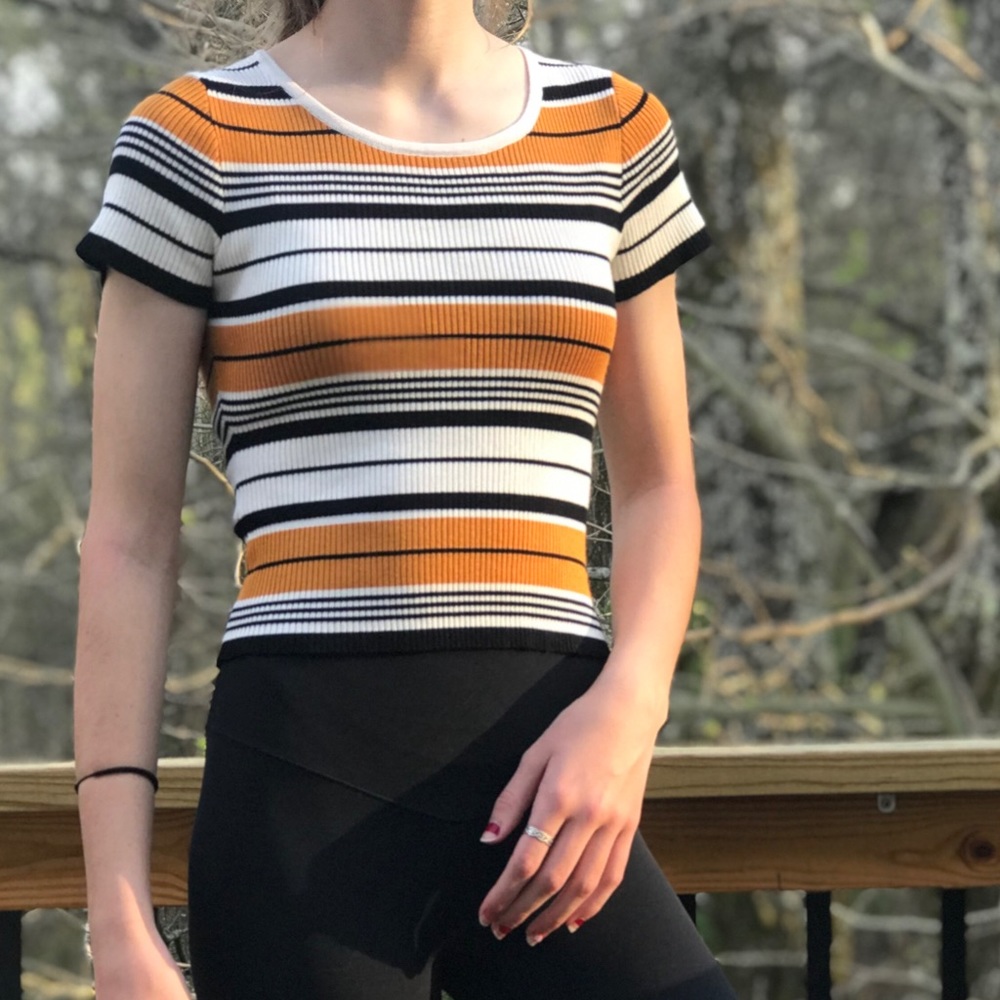 S stripped yellow, black, and white cropped shirt
